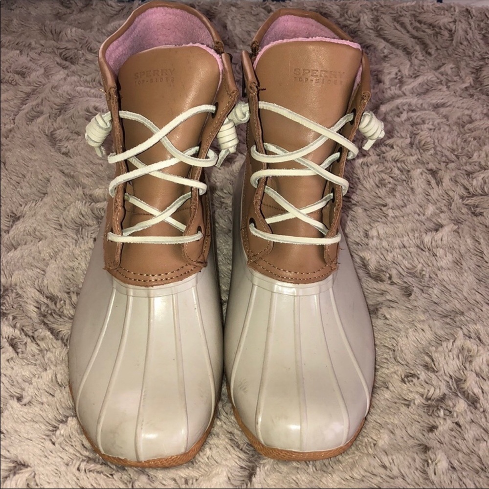 Tan and pink Sperry rain boots